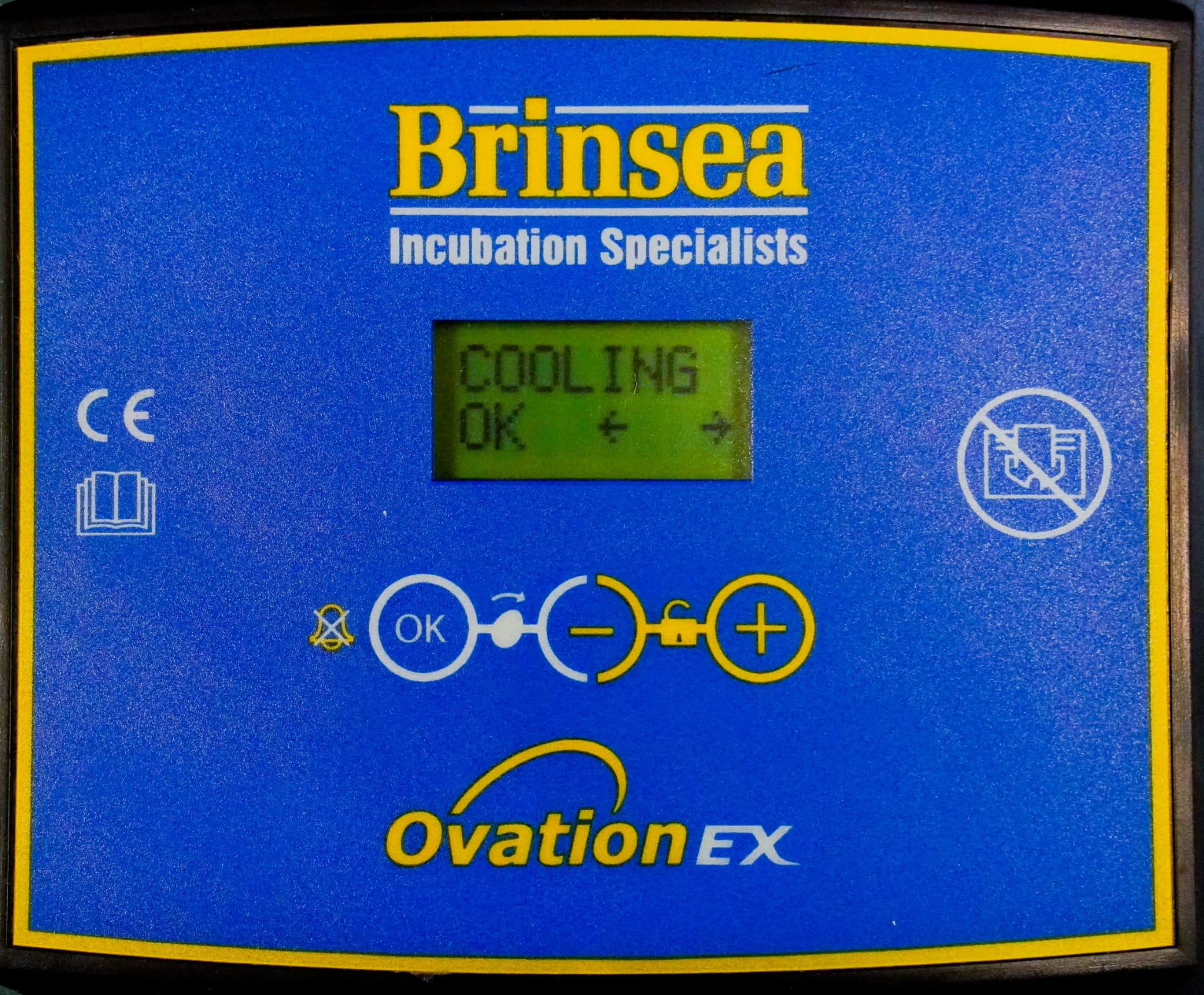 Brinsea incubator menu screen showing the 'COOLING' option selected.